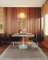 In 2005, Gretchen Rice and Kevin Farnham acquired a 1908 home in San Francisco that had been remodeled in the 1940s by well-known local architect Henry Hill. Their series of small interventions have kept the design intent of the 1940s renovation—including an enclosed atrium, wood wall paneling, and unusual built-ins—while updating the home for contemporary living. In the dining area, Metropolitan side chairs by Jeffrey Bernett for B&B Italia surround a Surf Table designed by Carlo Colombo for Zanotta.