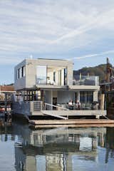 Amid the motley of architectural styles, from nautically inspired to shingled country cabin, Herbie Schlaepfer and Barbara Haeusermann's newly built, 2,894-square-foot home is like a palate cleanser for the eyes. One zinc cube cantilevers off the other, with great walls of glass that slide open and disappear.