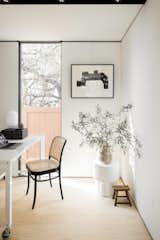 A second bedroom doubles as an office, should a renter prefer to use it that way. Oni balances earthen and elegant decor elements, emphasizing a small, personal collection throughout the ADU.