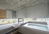 There is also a hot tub that looks out to views of the surrounding neighborhood.
