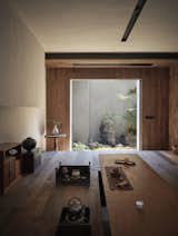 The tea room overlooks a petite outdoor space. Chen’s eye for scale guided the home’s build as well. "Bob’s father is a carpenter. He has been observing lines since he was a little boy," says Guang. "He is extremely sensitive when it comes to corners and lines."