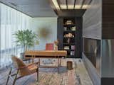 The office and library share an open bio-ethanol fuel fireplace by Ecosmart Fire.  The hearth is Walker Zanger Vintage Brown and stainless steel, the floors are polished concrete and the wood work is stained ash.