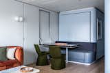 The custom dining table is paired with Mars dining chairs covered in Maharam wool by Konstantin Grcic.