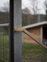 Entry handrail with shed beyond