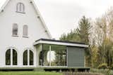 A Cutout in the Corner of This Belgian Home Leads to a New Dining Room